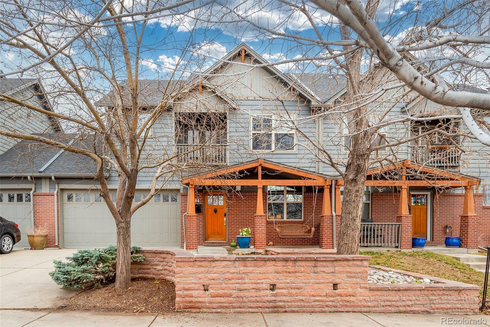 84 Inca Street Denver, CO 80223 - Photo 1 of 32 a view of a white house with a large tree