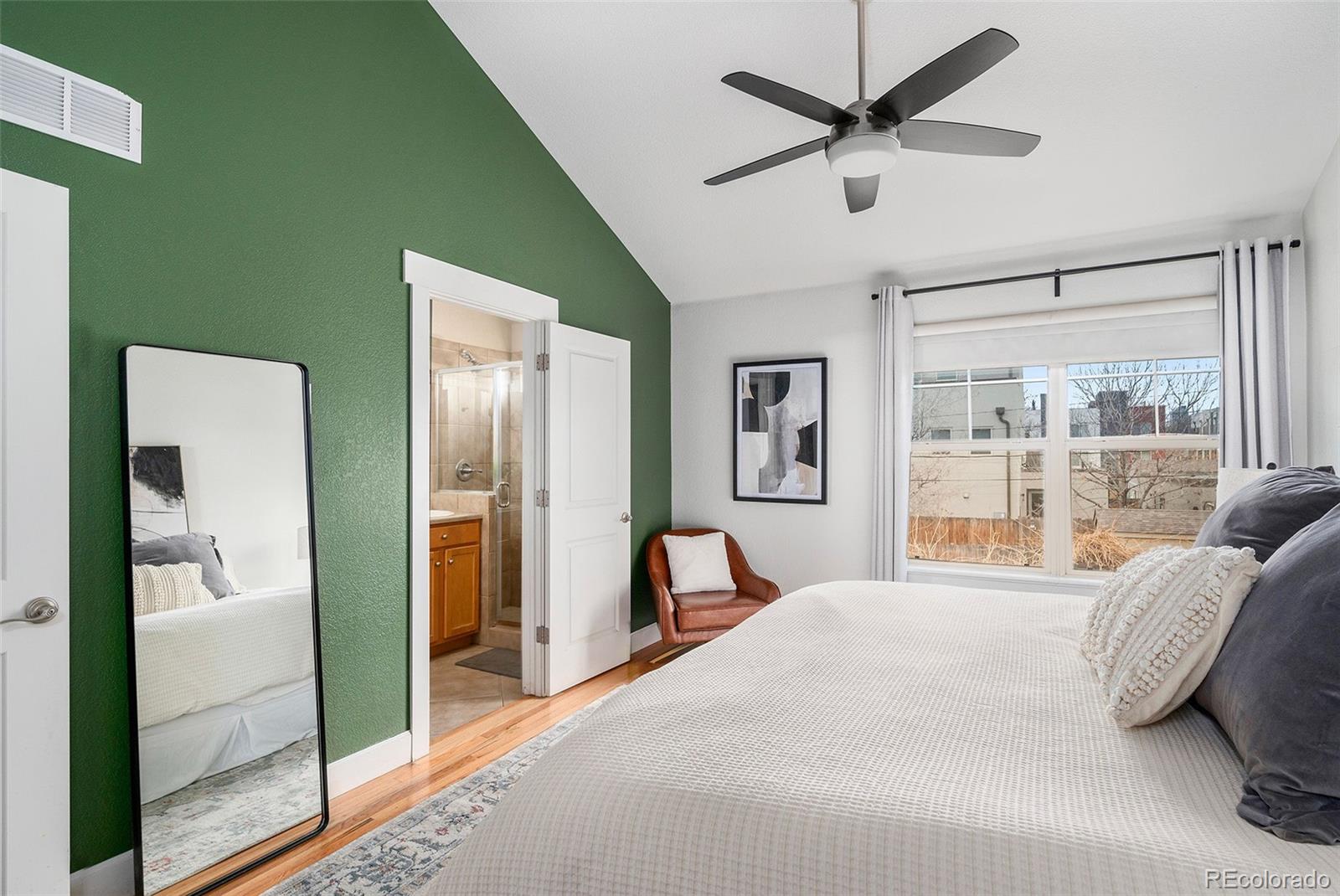 84 Inca Street Denver, CO 80223 - Photo 19 of 32 a bedroom with a bed and a large window