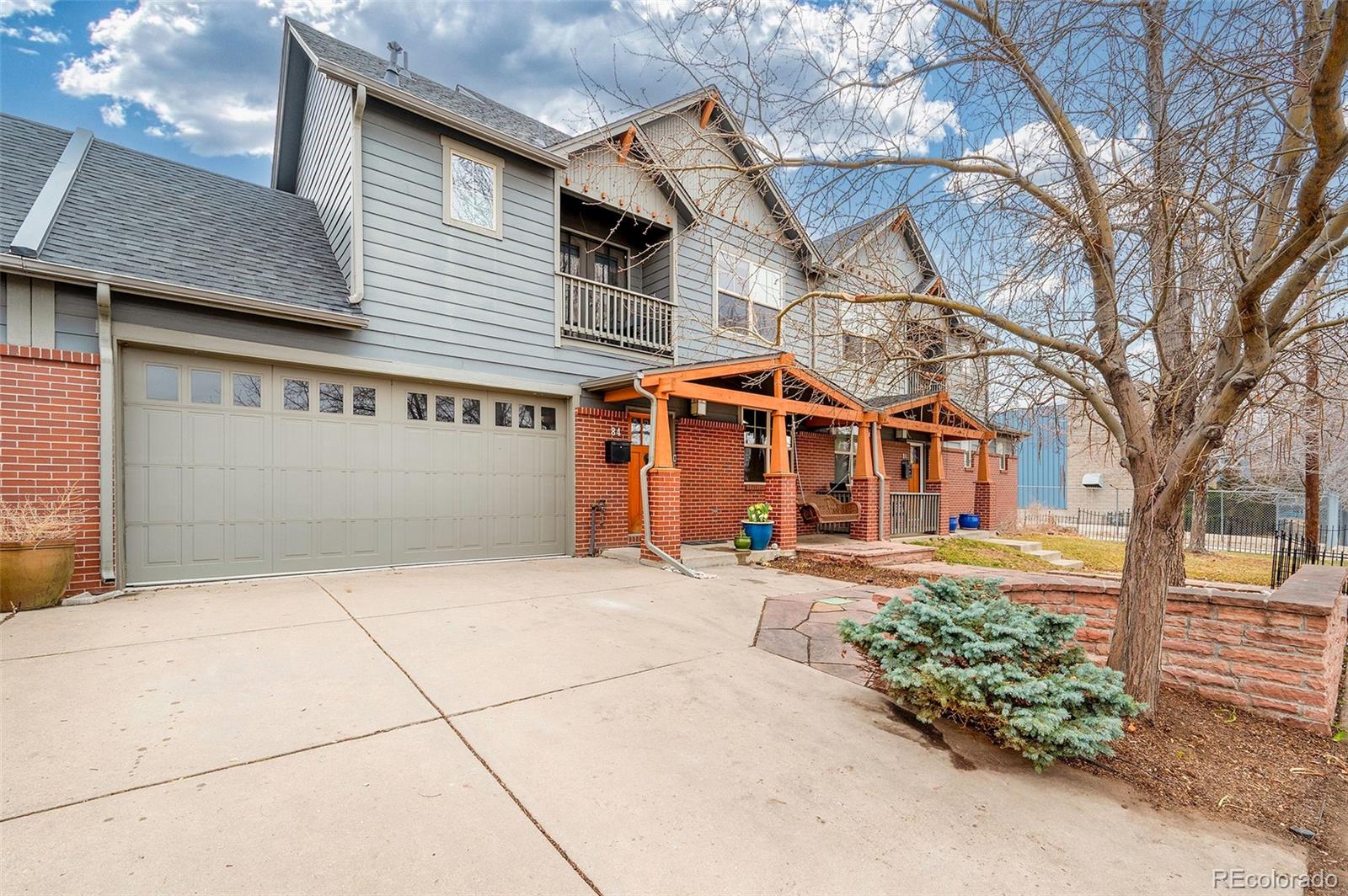 84 Inca Street Denver, CO 80223 - Photo 2 of 32 a front view of a house with garden