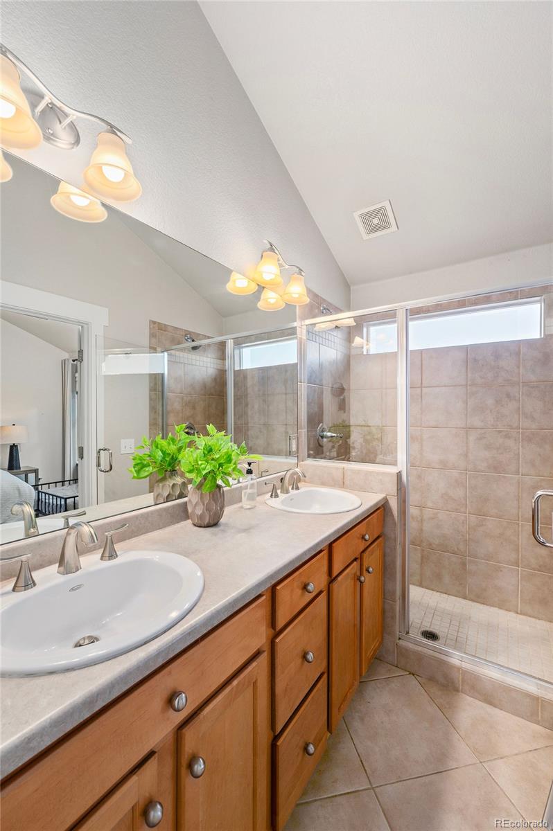 84 Inca Street Denver, CO 80223 - Photo 21 of 32 a bathroom with a sink and a mirror