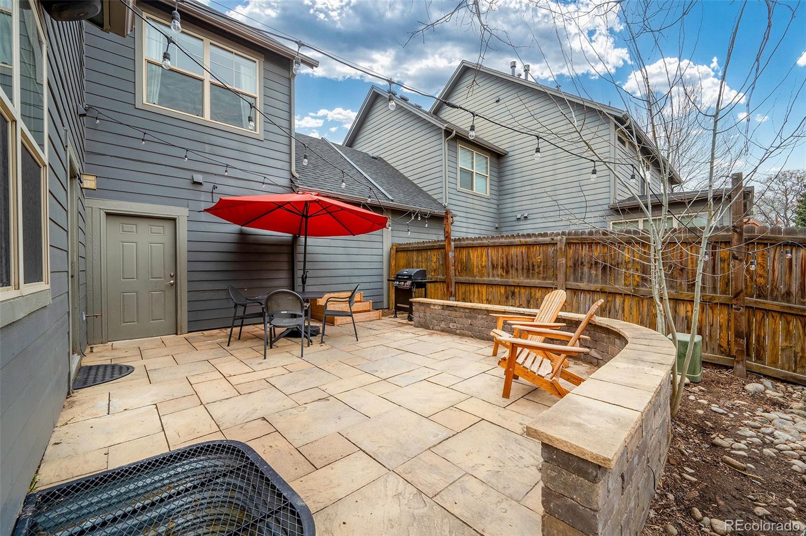 84 Inca Street Denver, CO 80223 - Photo 30 of 32 a view of outdoor space yard deck patio and outdoor seating