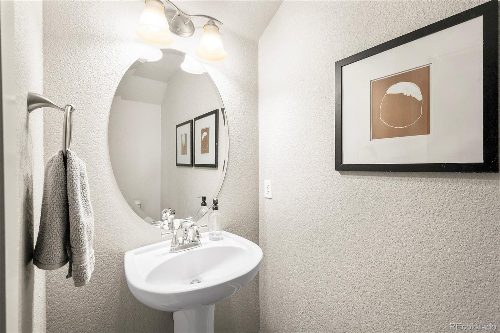 84 Inca Street Denver, CO 80223 - Photo 9 of 32 a bathroom with a sink and mirror