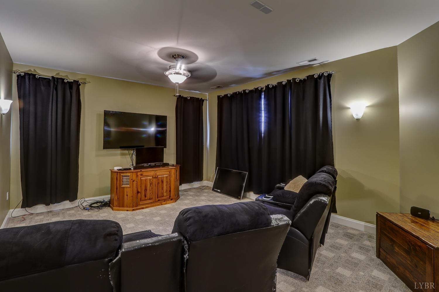Amazing movie room on second floor with blackout curtains!