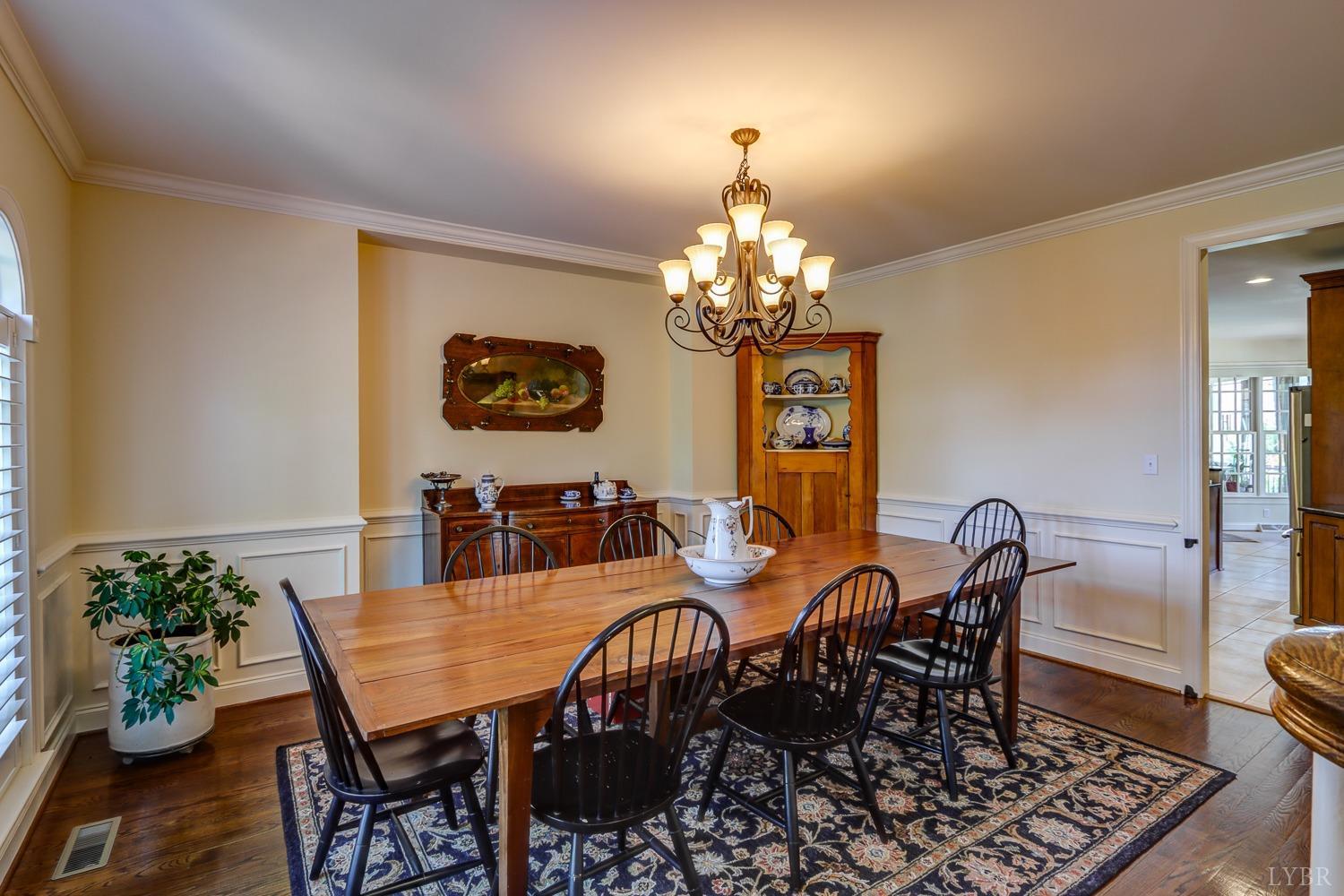 107 Emory Way Amherst, VA 24521 - Photo 12 of 84 a view of a dining room with furniture and chandelier