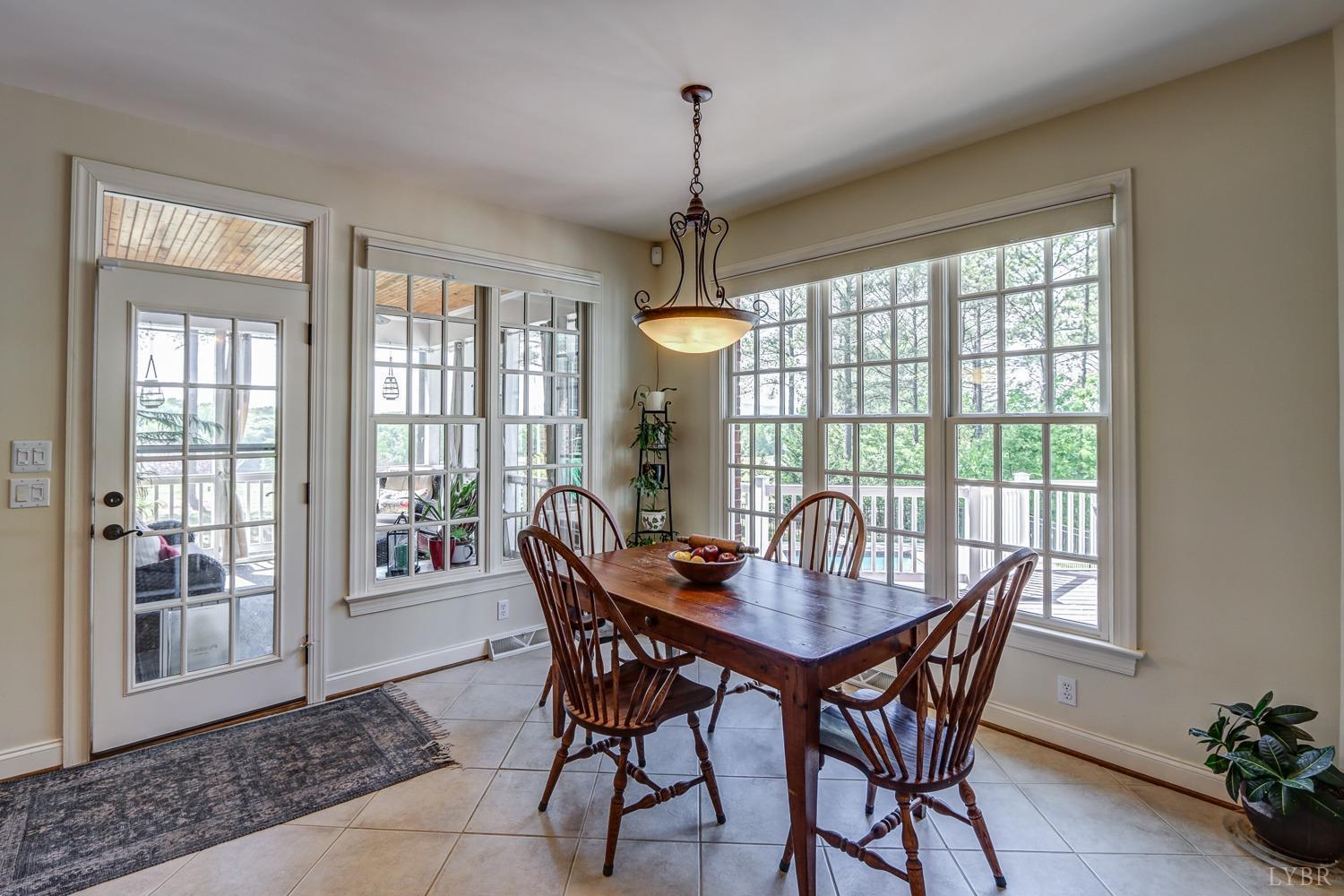 107 Emory Way Amherst, VA 24521 - Photo 16 of 85 a dining room with furniture window and wooden floor