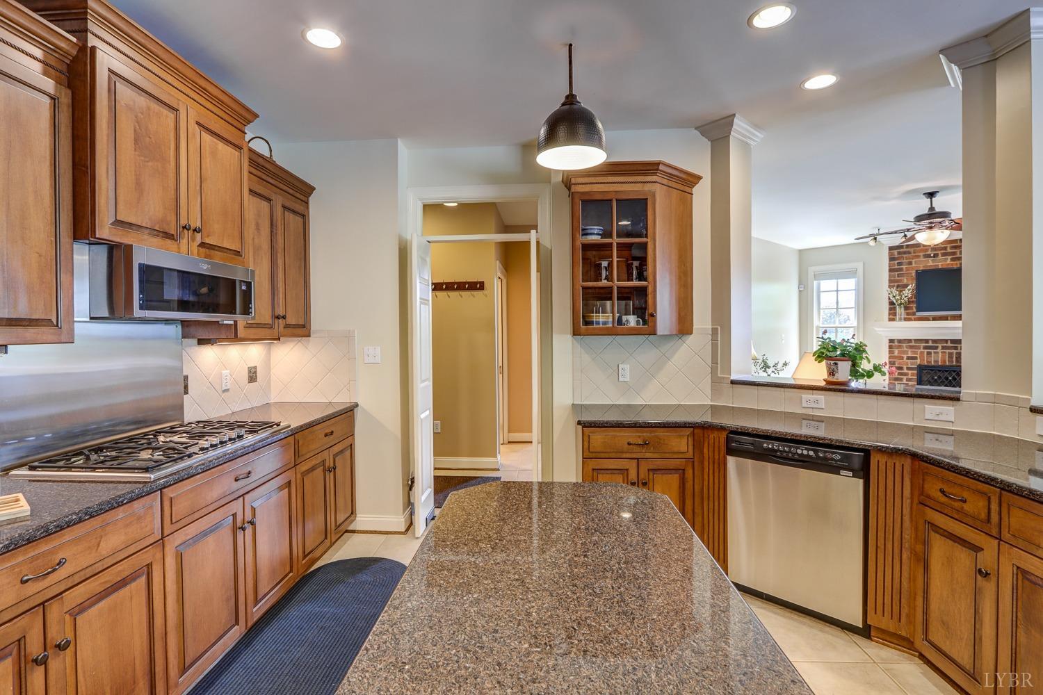 107 Emory Way Amherst, VA 24521 - Photo 22 of 84 a kitchen with stainless steel appliances granite countertop a stove and a sink