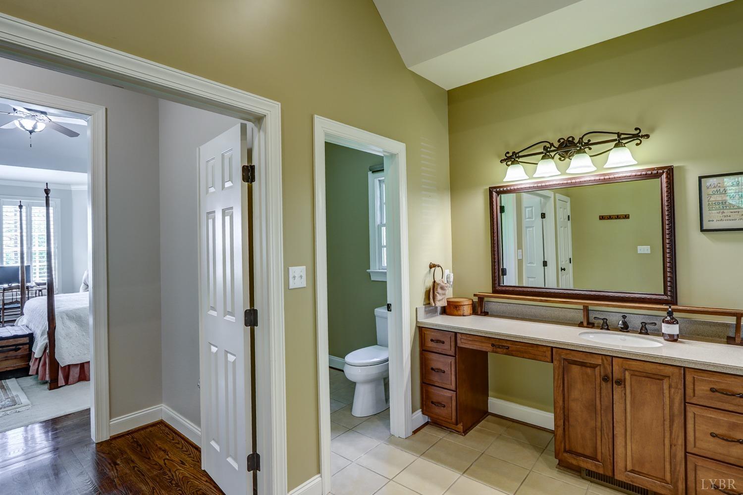 107 Emory Way Amherst, VA 24521 - Photo 44 of 85 a bathroom with a double vanity sink and a mirror
