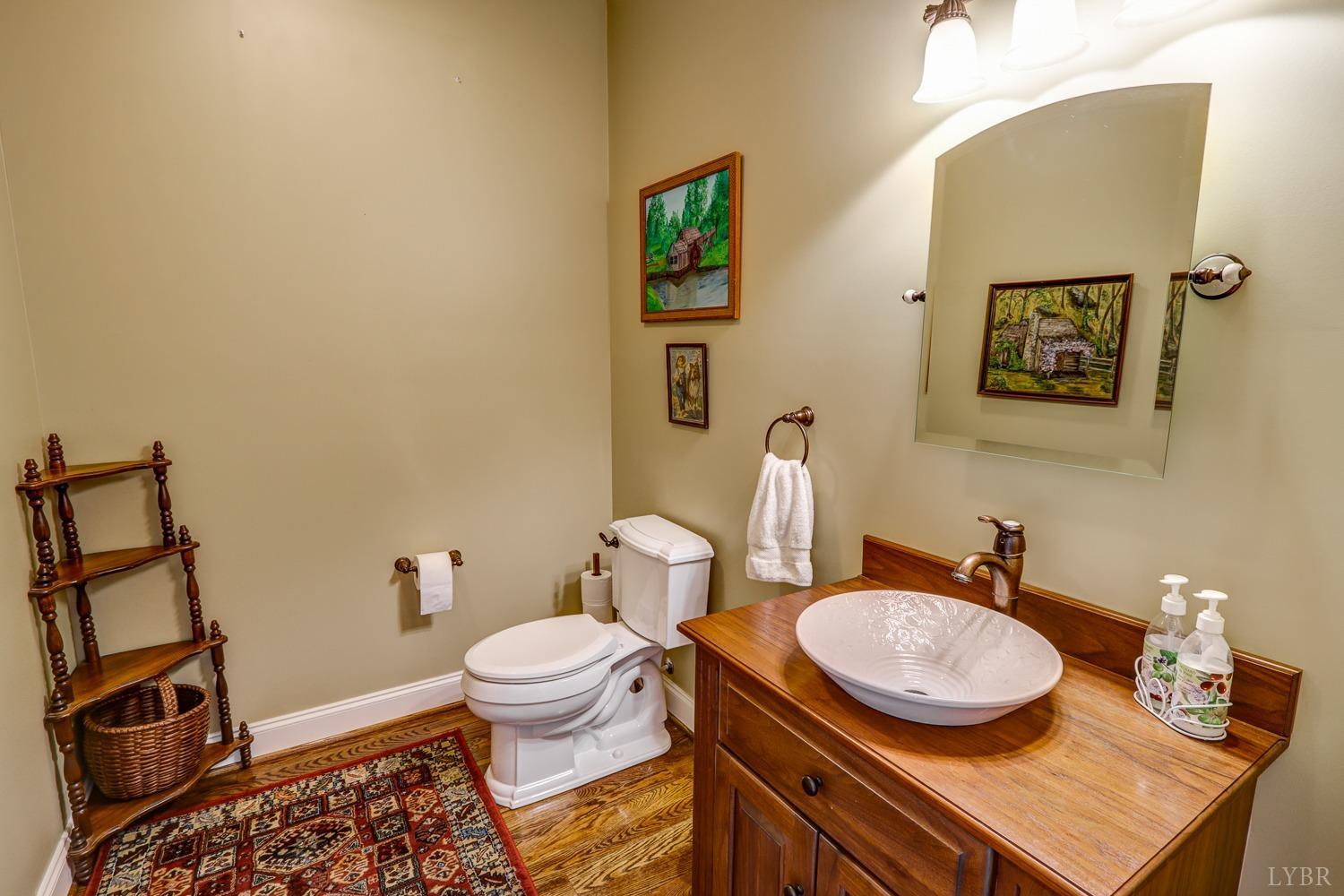 107 Emory Way Amherst, VA 24521 - Photo 6 of 84 a bathroom with a granite countertop toilet and a sink