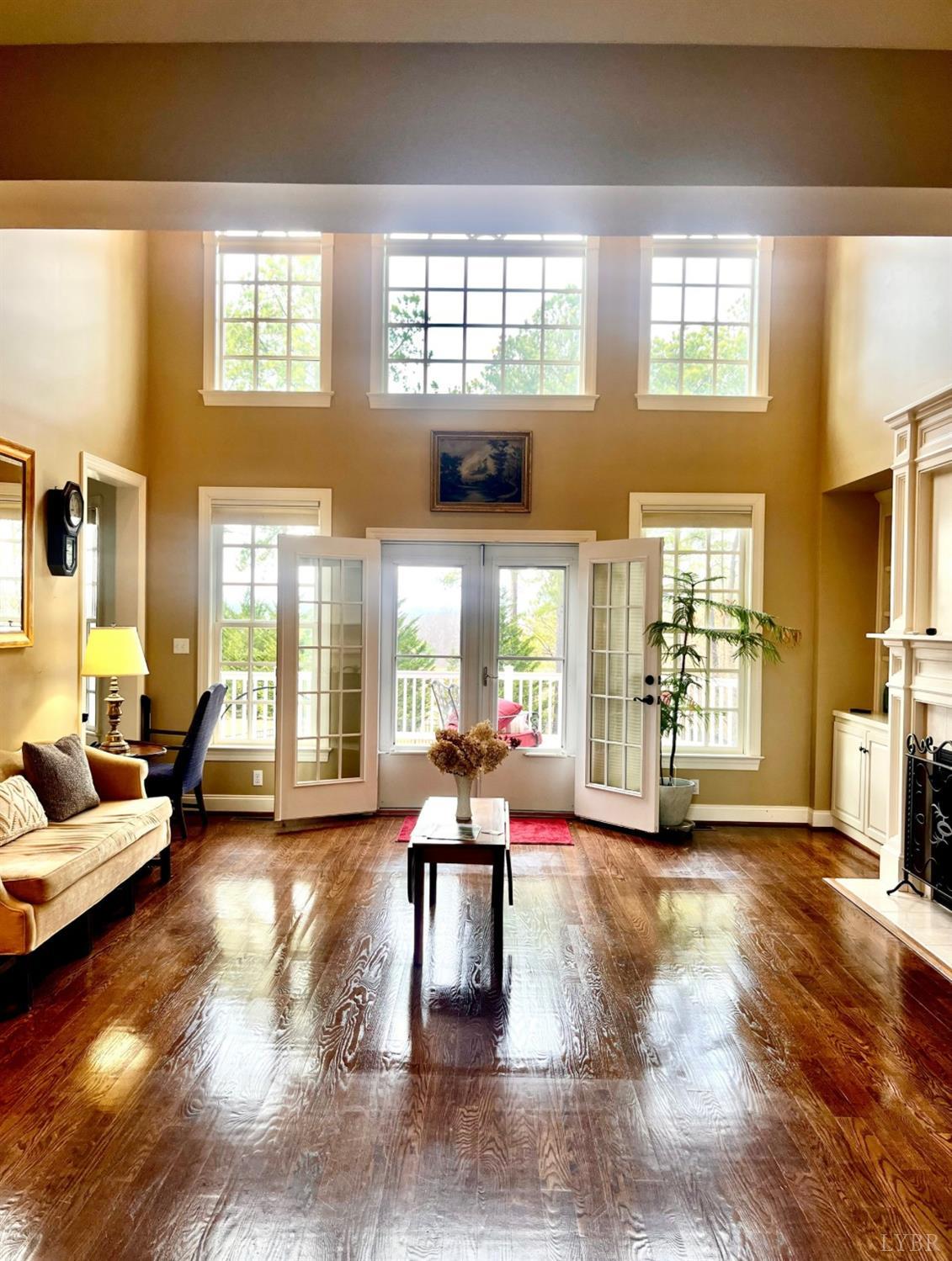 107 Emory Way Amherst, VA 24521 - Photo 8 of 84 a living room with furniture and large windows