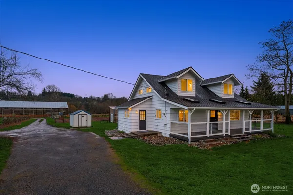 a view of a house with a yard