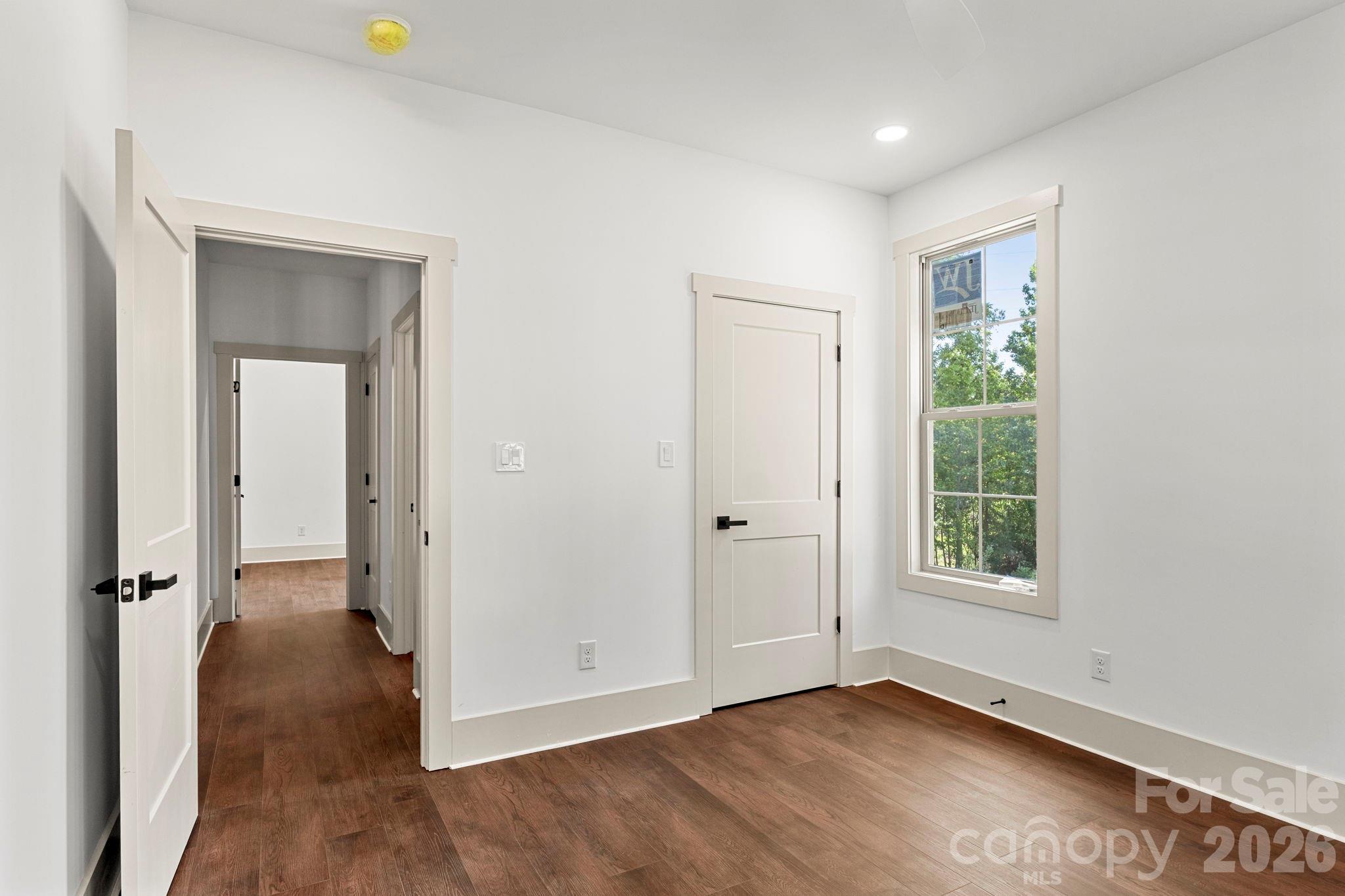 1167 Tirzah Road Rock Hill, SC 29732 - Photo 17 of 25 an empty room with wooden floor and a window