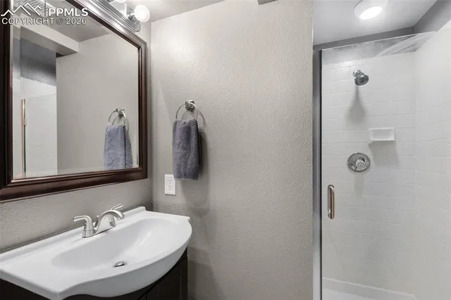 a bathroom with a sink and mirror