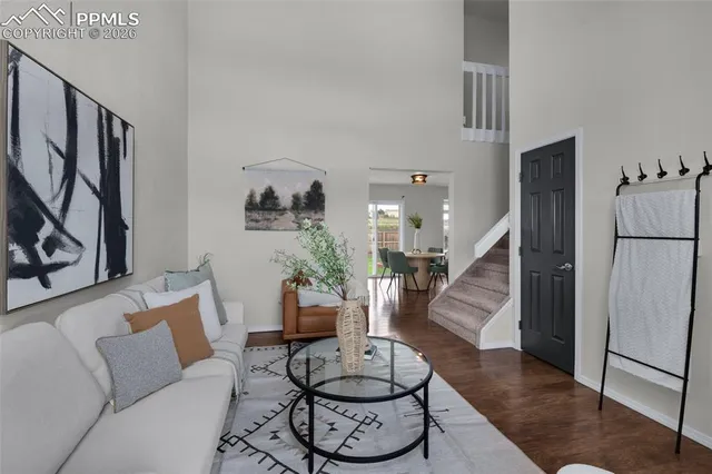 a living room with furniture and a table