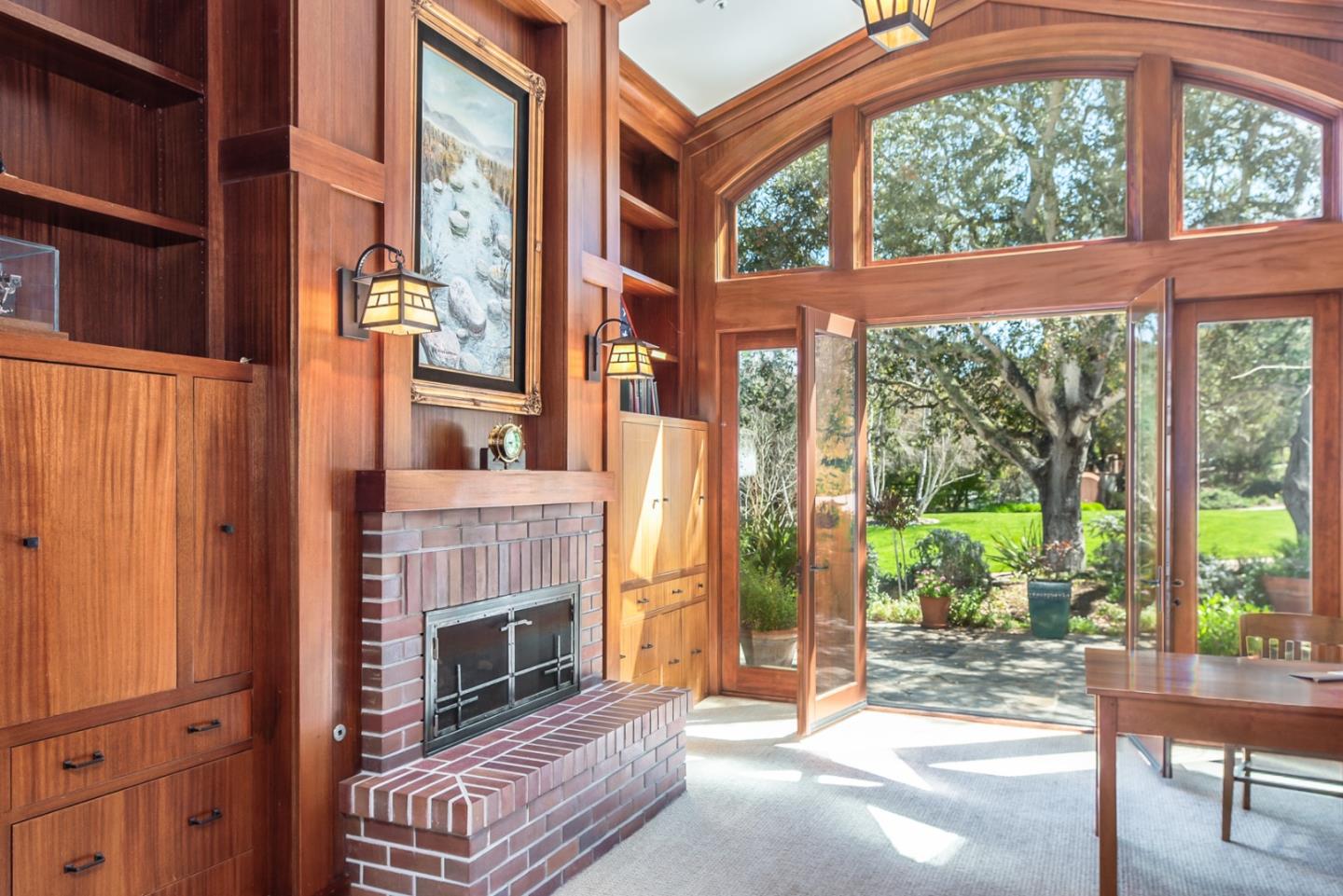 14550 Castlerock Road Salinas, CA 93908 - Photo 18 of 50 a living room with a fireplace and windows