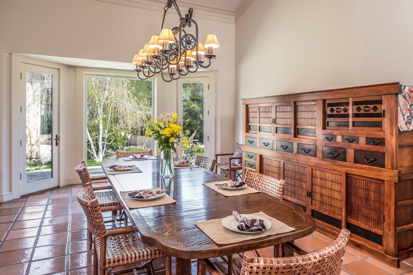 14550 Castlerock Road Salinas, CA 93908 - Photo 21 of 50 a view of a dining room with furniture a chandelier and wooden floor