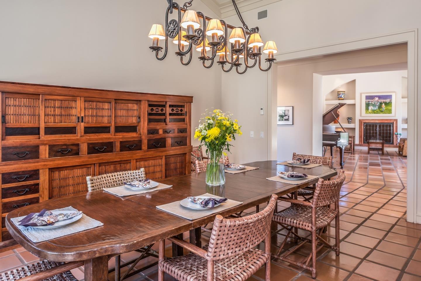 14550 Castlerock Road Salinas, CA 93908 - Photo 23 of 50 a view of a dining room with furniture a chandelier and wooden floor
