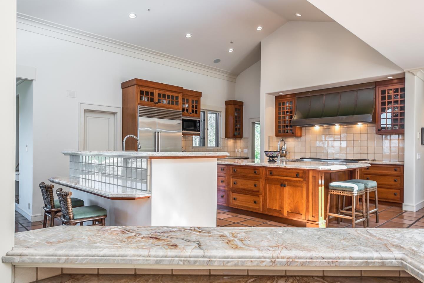 14550 Castlerock Road Salinas, CA 93908 - Photo 30 of 50 a view of living room kitchen with stainless steel appliances granite countertop cabinets and fireplace