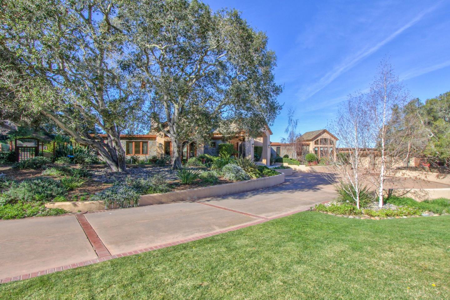 14550 Castlerock Road Salinas, CA 93908 - Photo 4 of 50 a view of a street with a building and a street sign