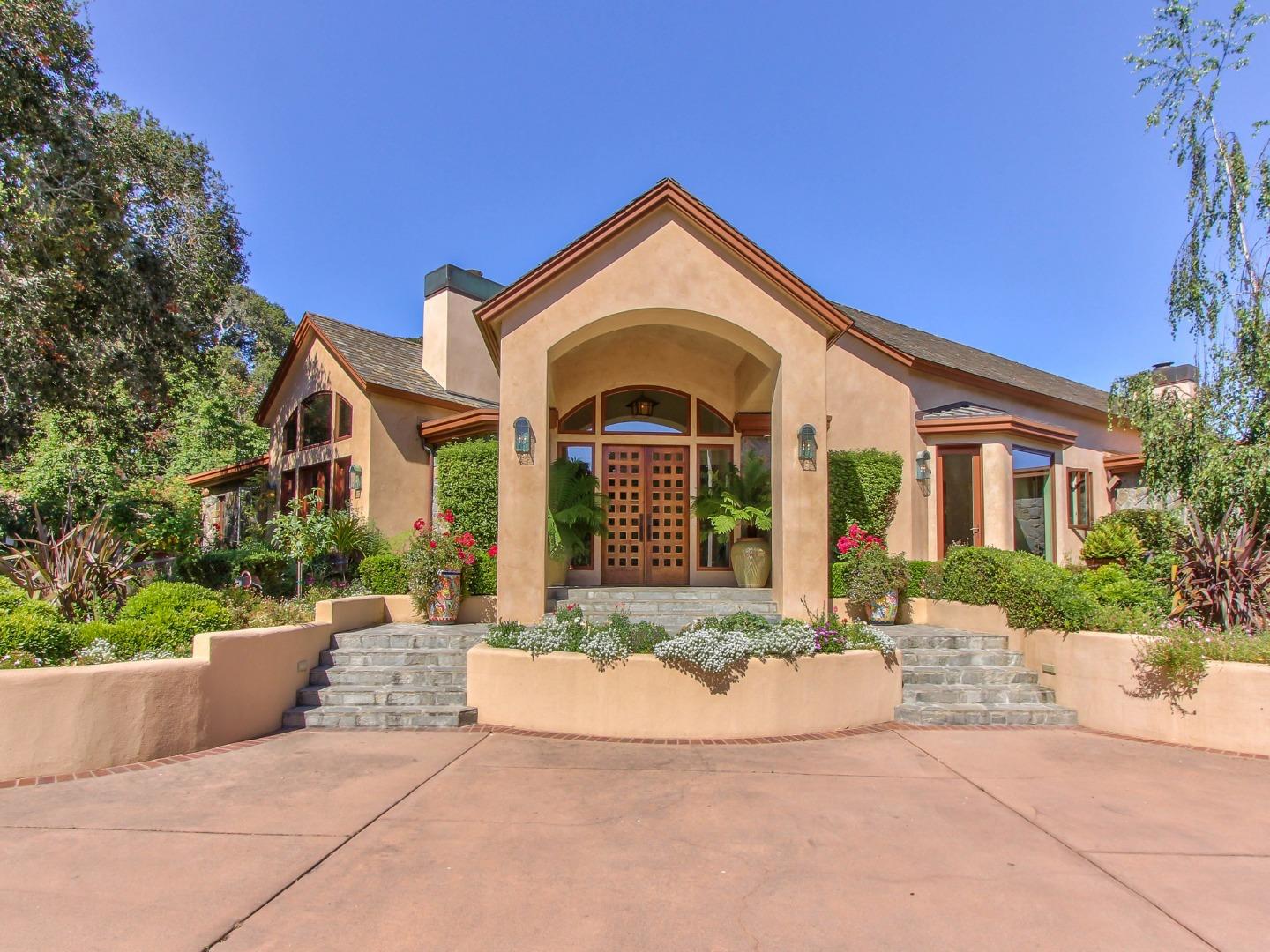 14550 Castlerock Road Salinas, CA 93908 - Photo 6 of 50 a front view of a house with a yard and potted plants