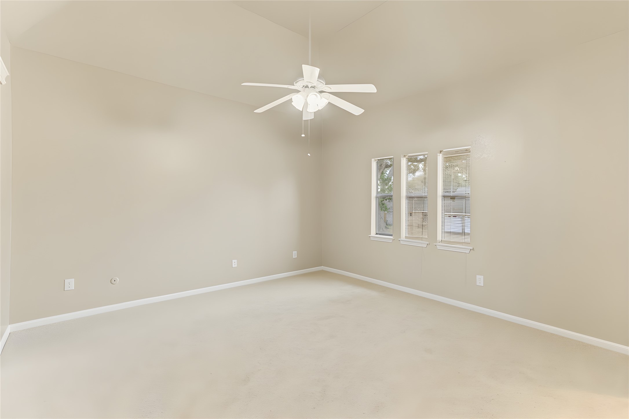 57 South Bachelor Button Street Lake Jackson, TX 77566 - Photo 15 of 29 Oversized Primary Bedroom (15x14) easily accommodates larger furniture items & features vaulted ceilings that enhance the open, airy feel of the space.