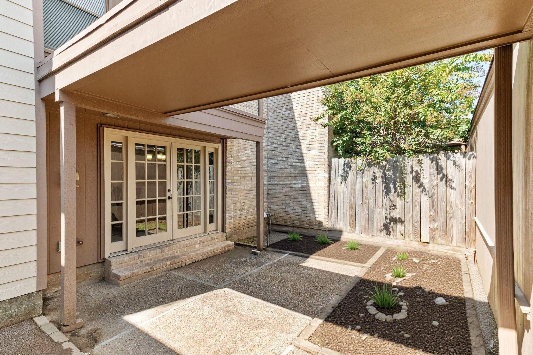 57 South Bachelor Button Street Lake Jackson, TX 77566 - Photo 26 of 29 Private courtyard provides a quiet outdoor retreat just off the main living area. Buyers will be pleased to know that all electrical throughout the townhouse has been brought up to code.