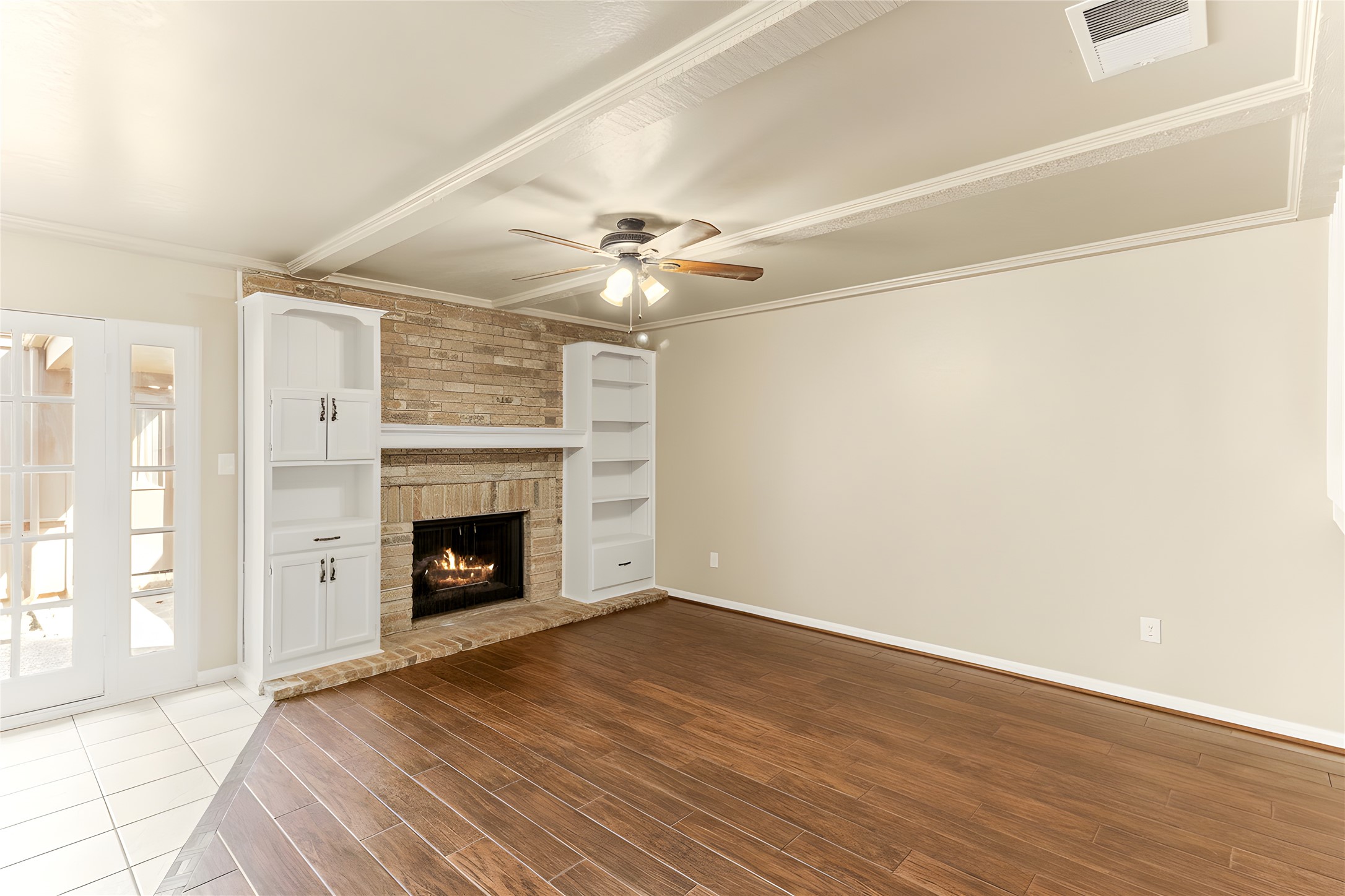 57 South Bachelor Button Street Lake Jackson, TX 77566 - Photo 5 of 29 Great sized Family Room (14x22) featuring a brick gas fireplace framed by freshly painted built-ins creating an inviting focal point perfect for displaying your favorite décor or statement pieces.