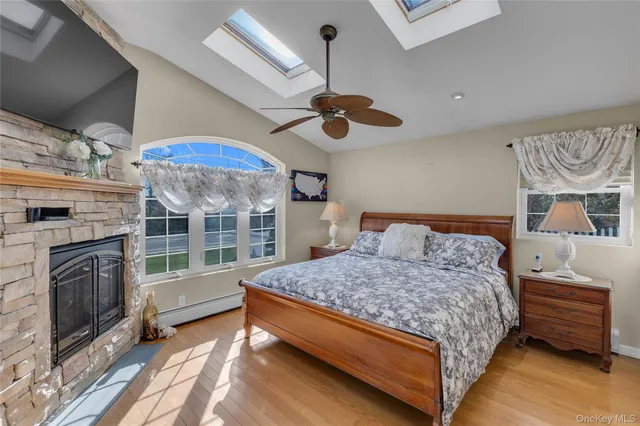 a bedroom with a bed dresser and a window