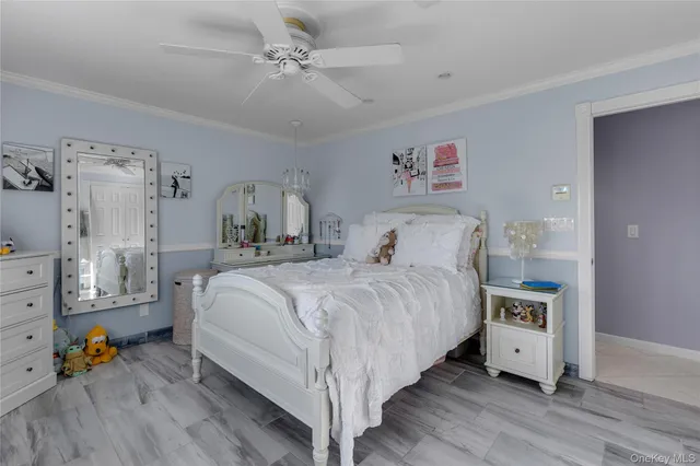 a bed room with a bed and a chandelier