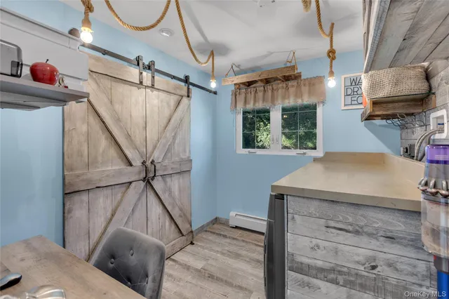 a living room with a bed and a window