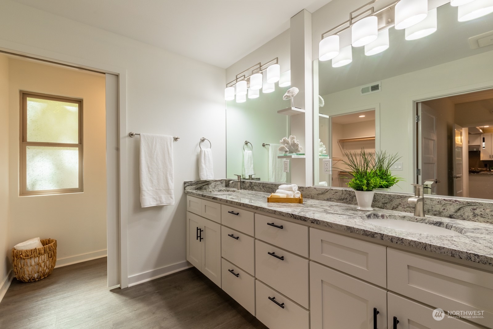 4901 Cleveland Street Port Townsend, WA 98368 - Photo 25 of 39 a bathroom with a granite countertop sink and a mirror