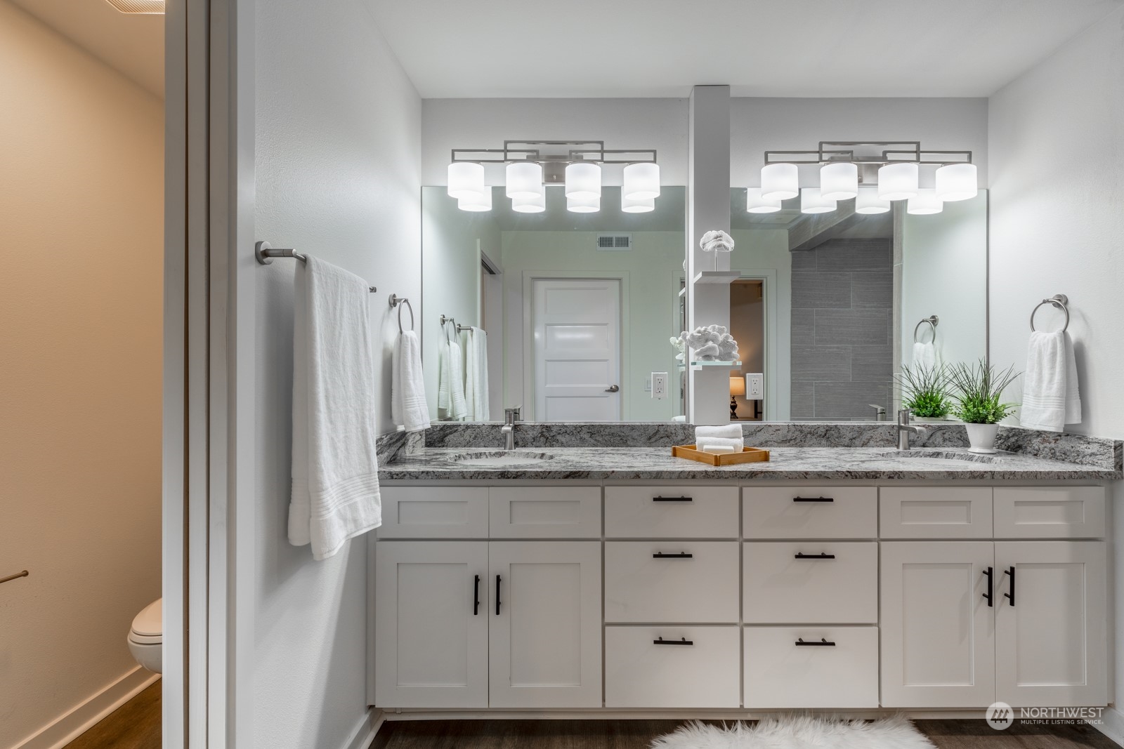 4901 Cleveland Street Port Townsend, WA 98368 - Photo 27 of 39 a bathroom with a granite countertop sink and a mirror