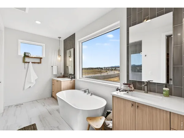 a bathroom with a sink and a large mirror