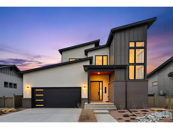a front view of a house with a garage