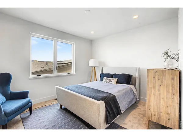 a bedroom with a bed and a couch
