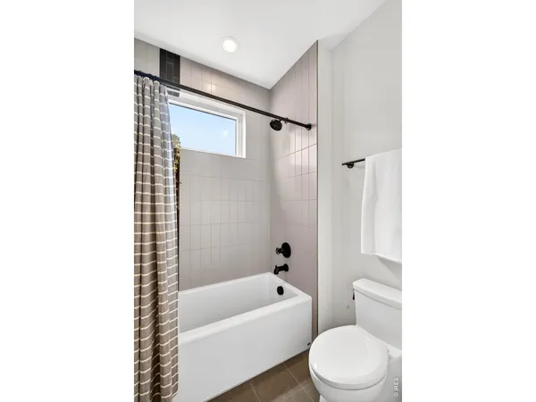 a bathroom with a toilet a sink and a bathtub