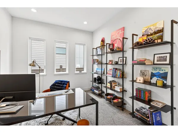 a living room with lots of furniture and a flat screen tv