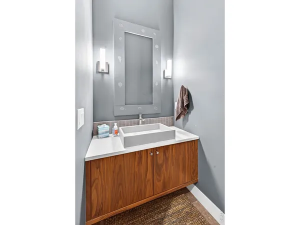 a en suite bathroom with a sink and a mirror