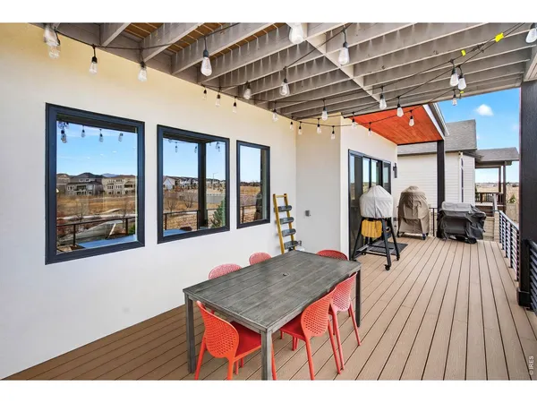a outdoor space with wooden floor and windows