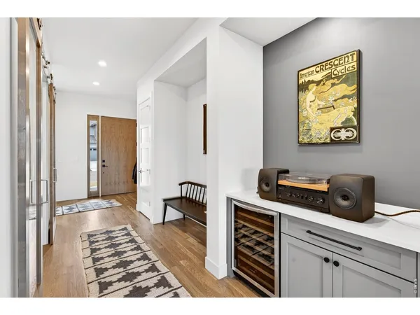 a kitchen with a refrigerator and a sink