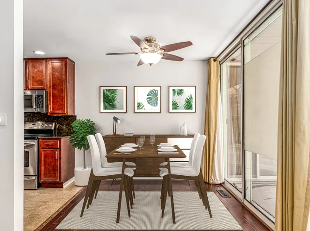 a dining room with furniture and window