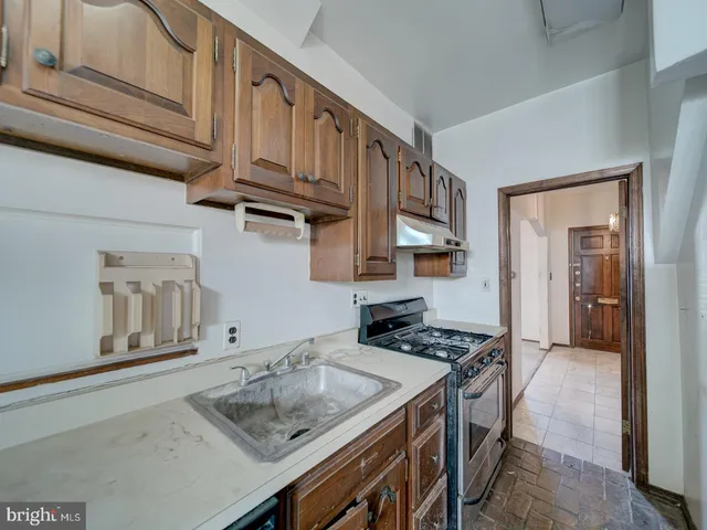 a kitchen with a stove and a refrigerator