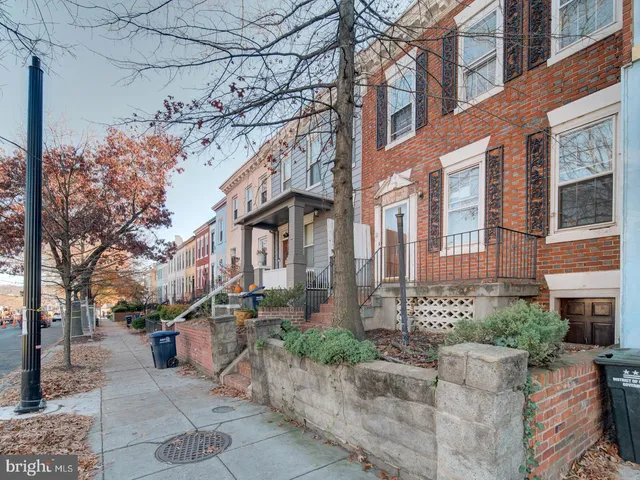 a view of a building with a yard