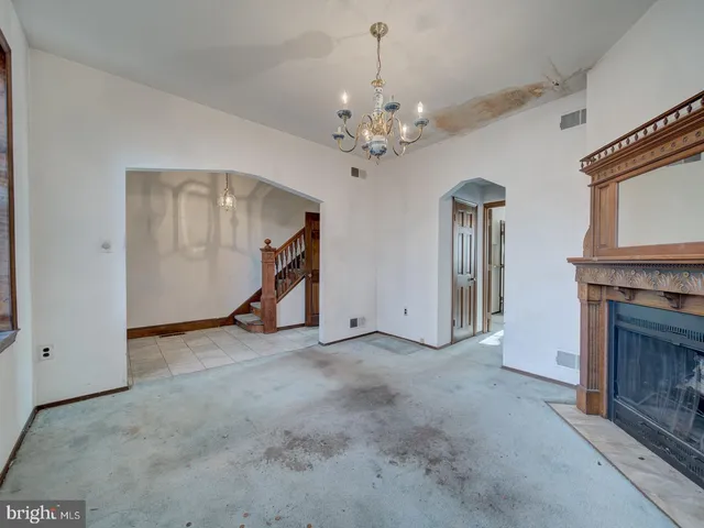 an empty room with windows and entrance