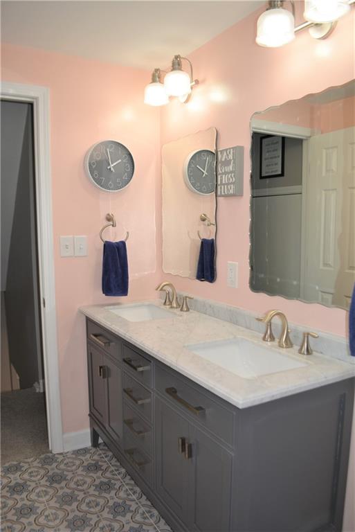3035 Pitchfork Drive McKees Rocks, PA 15136 - Photo 14 of 21 a bathroom with a sink and a mirror
