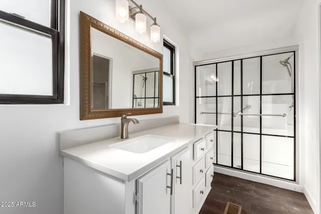 a bathroom with a sink and a mirror