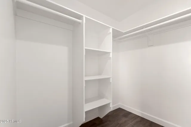 a view of an empty walk in closet