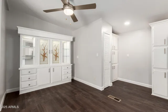 a view of cabinets and wooden floor