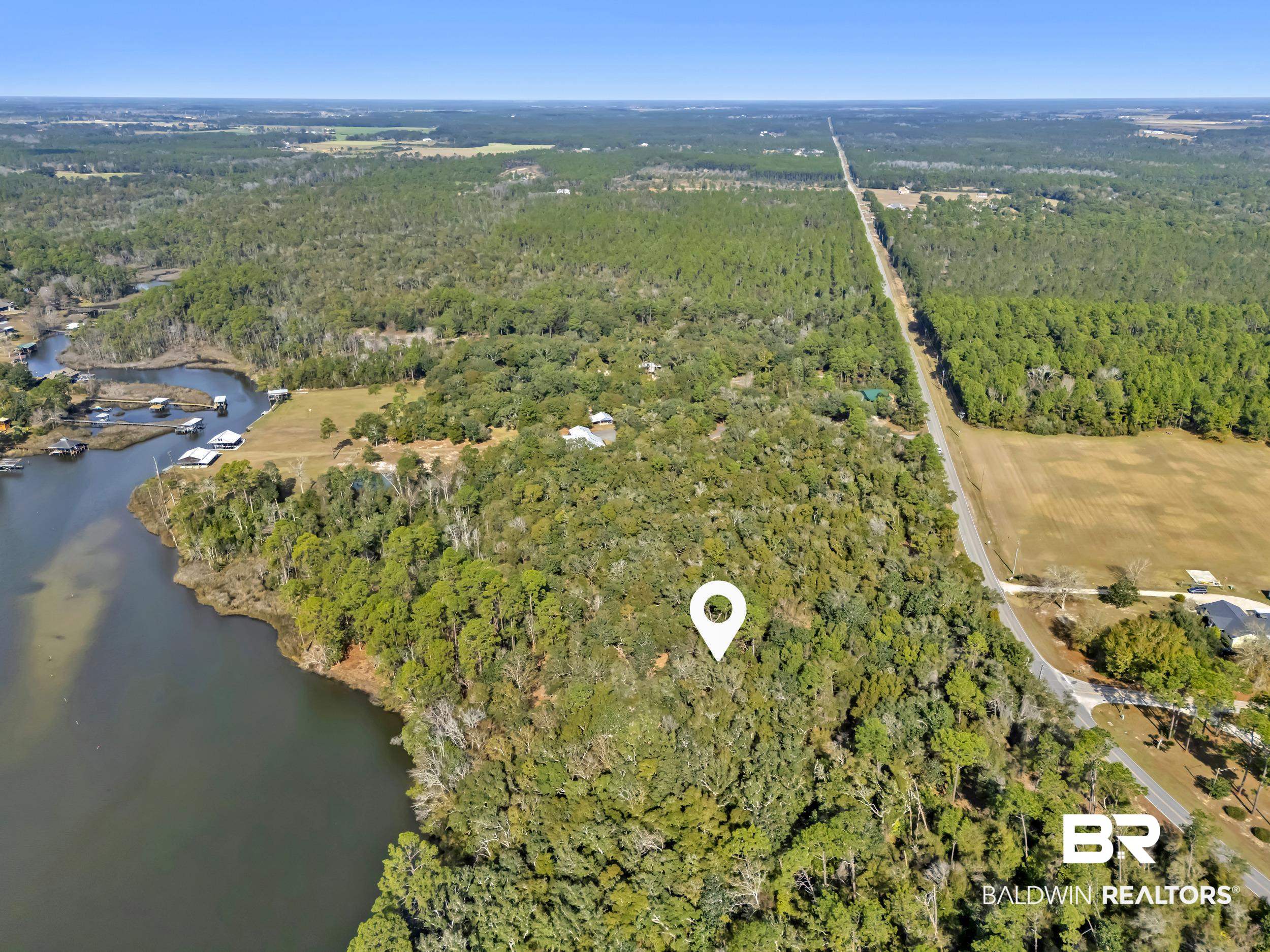 0 County Road 97 Elberta, AL 36530 - Photo 21 of 29 Aerial view of property's location featuring a forest and a large body of water