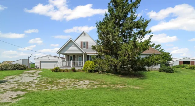a front view of house with garden