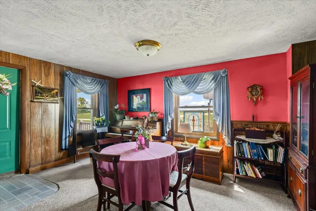 a view of a dining room with furniture window and outside view
